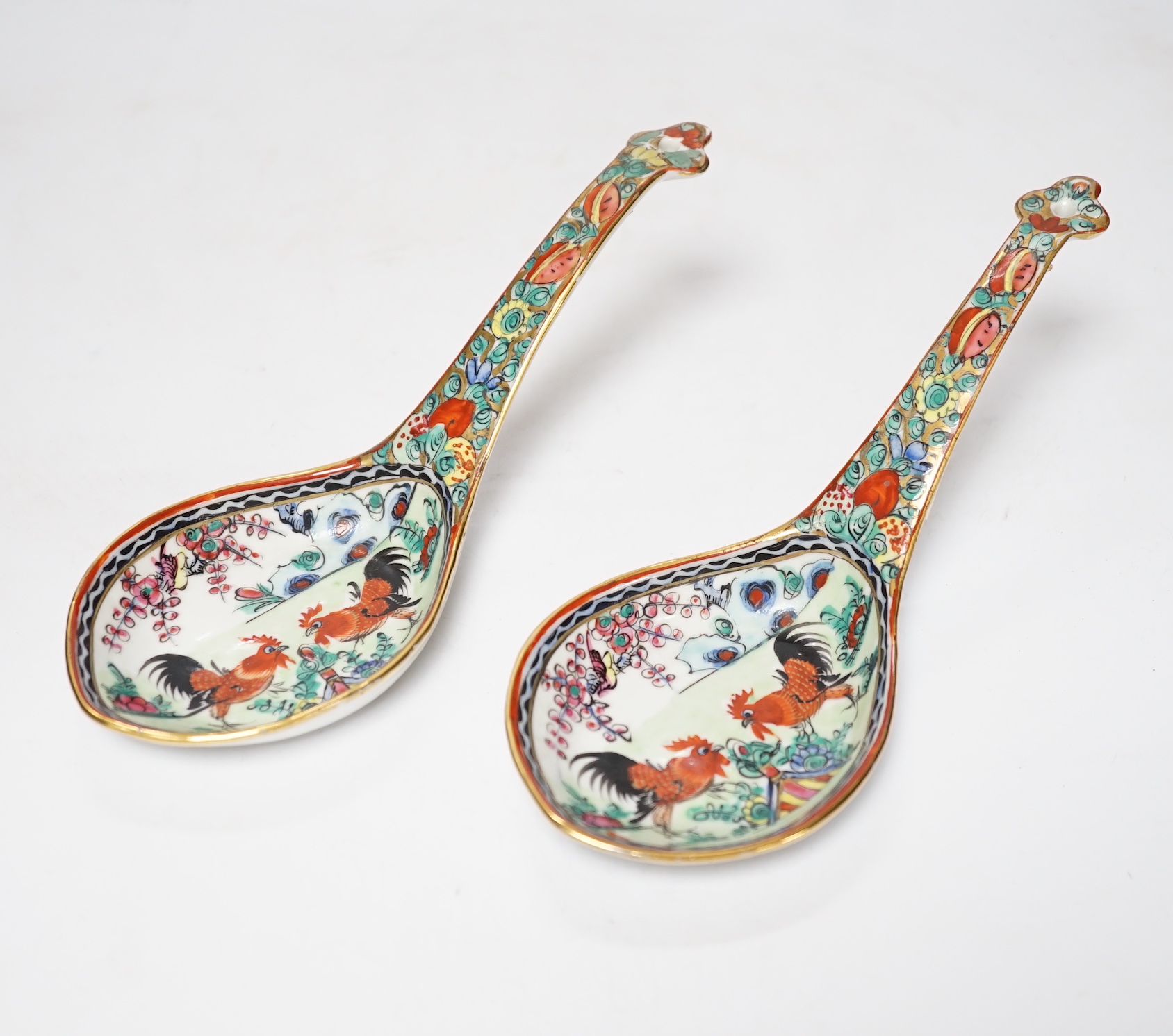 A pair of mid 20th century Chinese enamelled porcelain spoons, 21cm